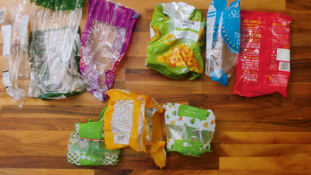 Crisp packets, veg bags and bread bags on a counter top